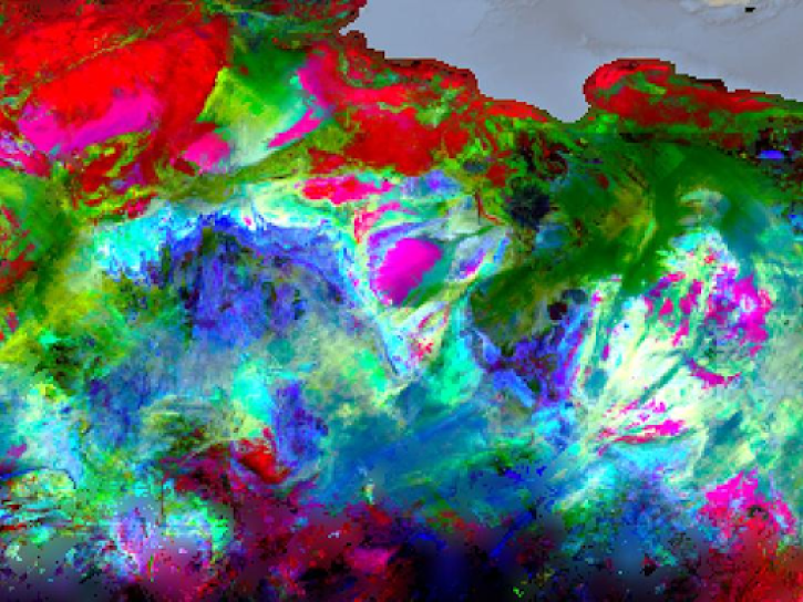 An image showing part of a trivariate chloropleth surface mineral map of northern Africa showing hematite in red, goethite in green, and kaolinite in blue.