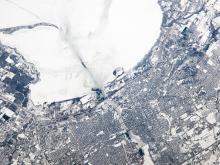 Taken from the International Space Station (ISS), this photograph shows the city of Green Bay, Wisconsin, at the southern end of icebound Green Bay, a basin of Lake Michigan. The heavy snowfalls of winter 2014 cover the landscape. 
