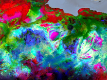 An image showing part of a trivariate chloropleth surface mineral map of northern Africa showing hematite in red, goethite in green, and kaolinite in blue.