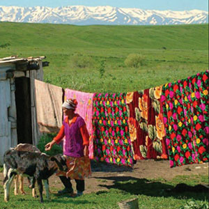 Nomadic people, such as this woman and her cattle, formed the pastoral society common in Kazakhstan before the Soviet Union converted thousands of acres to large-scale modern farm operations.