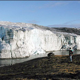 A researcher observes the edge of the Greenland Ice Sheet in 2001. (Image courtesy of Ted Scambos, National Snow and Ice Data Center, University of Colorado at Boulder).