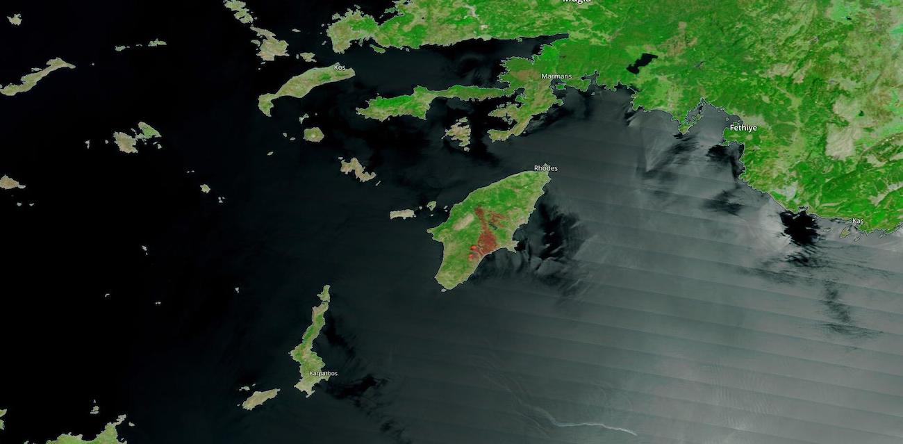 False-color corrected reflectance image of burned area and fires on the island of Rhodes, Greece on 26 July 2023 from the MODIS instrument aboard the Terra satellite False-color corrected reflectance image of burned area and fires on the island of Rhodes, Greece on 26 July 2023 from the MODIS instrument aboard the Terra satellite