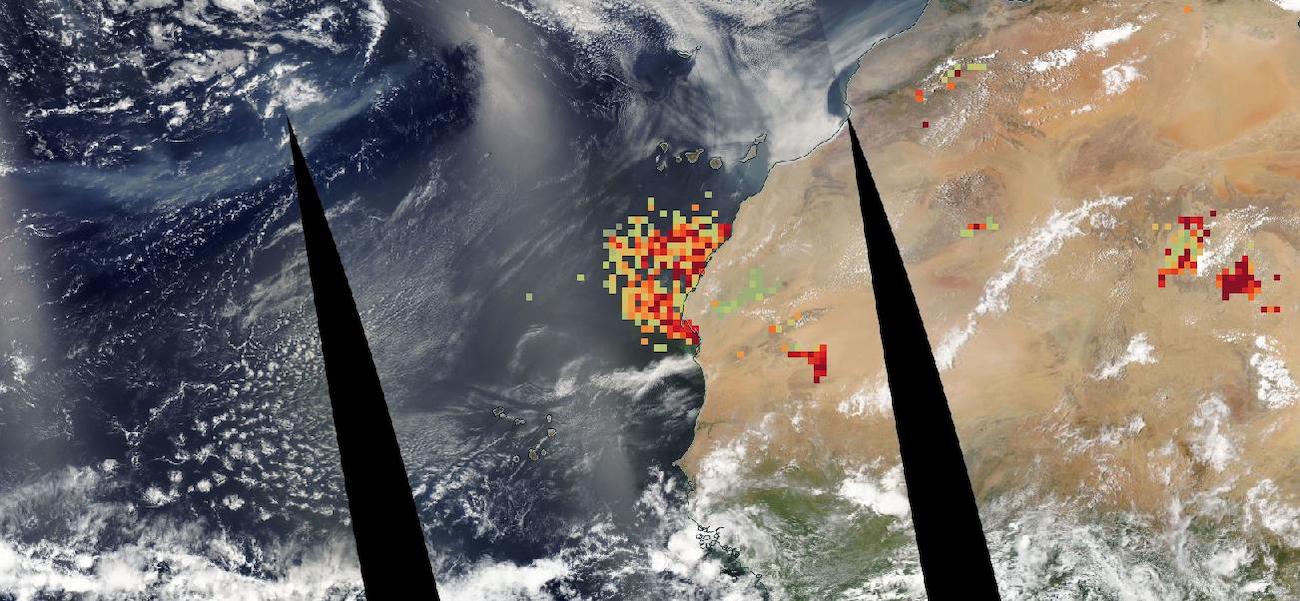 Aqua/MODIS image of the west African coast from June 29, 2023, overlain with dust score; colored dots ranging from green to crimson indicate high dust concentrations.