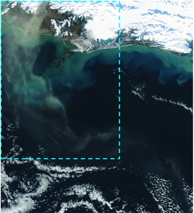 Satellite image of a dust event in Alaska, with brown swirls of dust interspersed with white clouds and green ocean