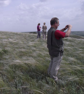 Photograph of researchers in a Russian grassland