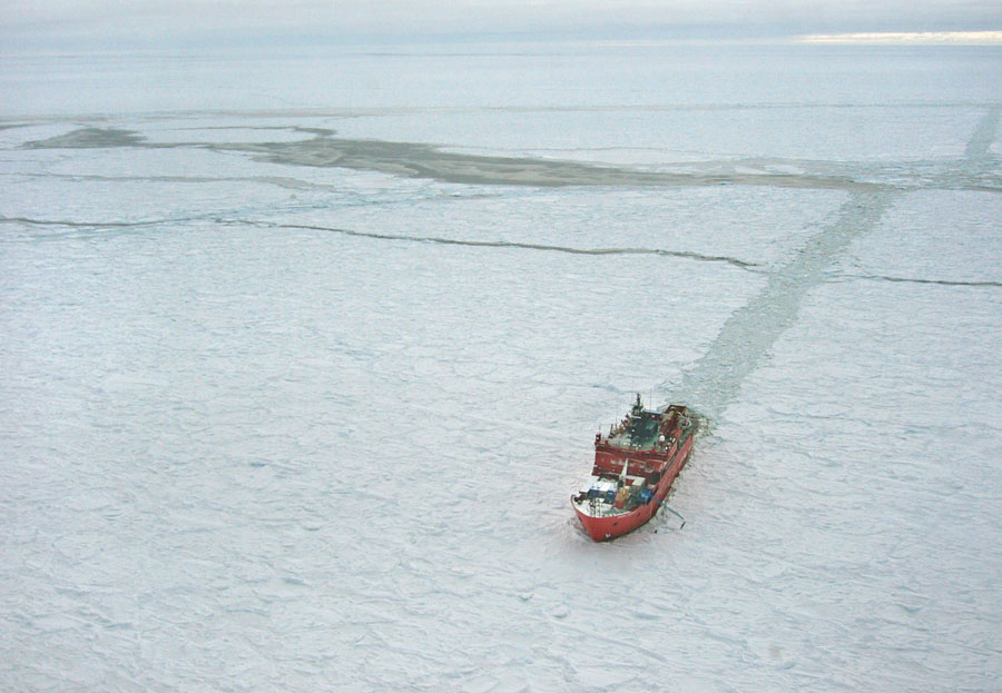 Aerial photograph of an icebreaker churning through Antarctic sea ice