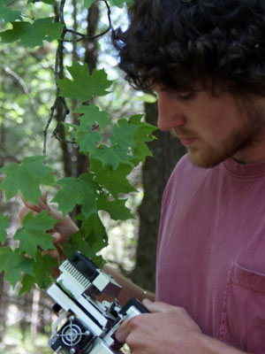 Photograph of a student taking photosynthesis measurements