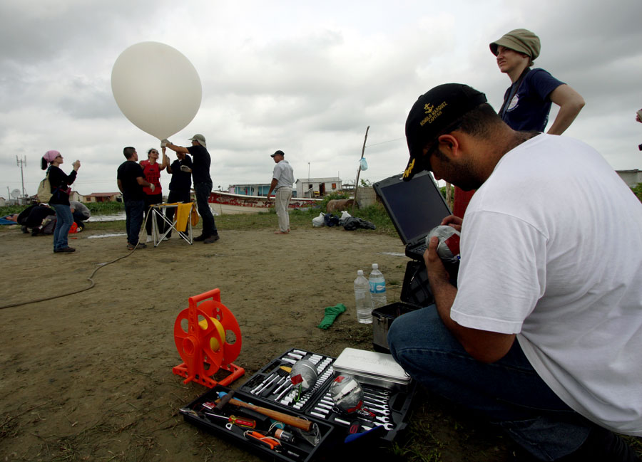 Photograph of researchers preparing to deploy a weather balloon