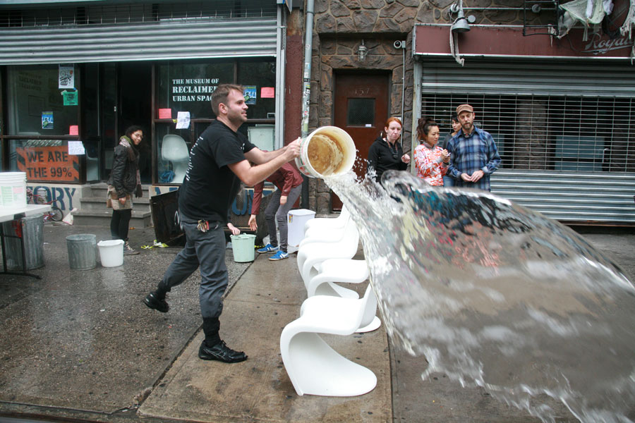 Photograph of volunteers bailing water out of a museum in New York City after Hurricane Sandy