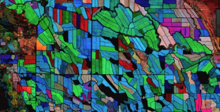 Multi-temporal Enhanced Vegetation Index-2 (EVI2) information from HLS for an area of irrigated cropland of Central California (near Los Banos), USA. The colors represent mean EVI2 for three periods of the 2018 growing season: Red areas peak early in the season, Green areas peak in the middle, and Blue areas peak late. For more information on this work, see Using NASA's HLS Product to Give Farmers Real-Time Crop Health Information on the NASA Landsat Science website. Image: Landsat/Sulla-Menashe, et al.