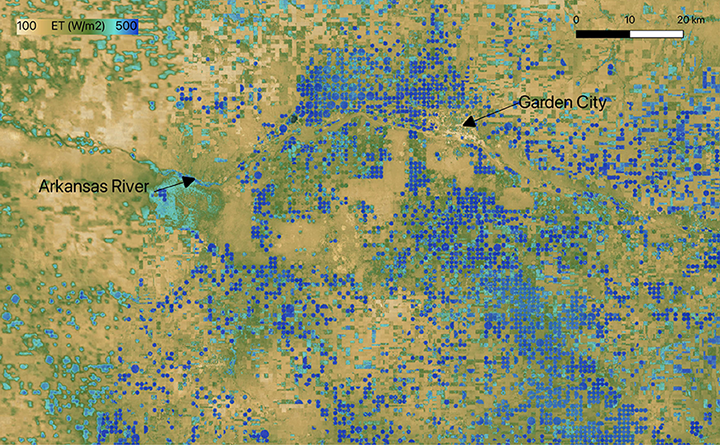 This August 2022 evapotranspiration (ET) image from ECOSTRESS shows areas of high ET (blue) over pivot irrigation circles around Garden City, Kansas, illustrating that the crops are releasing small amounts of water as they photosynthesize, indicating healthy vegetation. The unmanaged background is clearly drier and more stressed (tan colors), showing the impact of sustained drought. 
