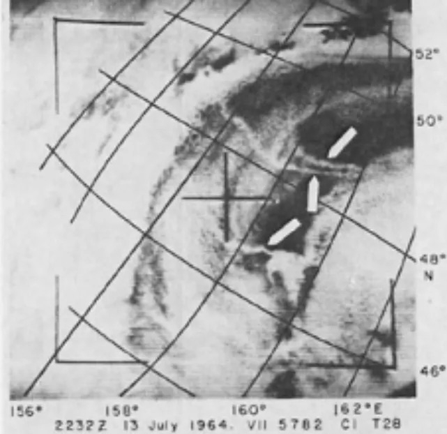 Satellite image captured in 1966 by the TIROS weather satellite depicting white clouds interspersed with dark areas representing anomalous cloud lines