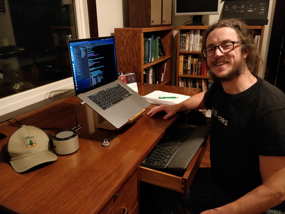 Dr. Anthony Walker in his home office engaged in some coding.