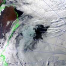 An unusual area of open water surrounded by persistent ice, captured in this MODIS image in mid-September, appeared during the melt season. 