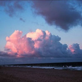 Cumulus clouds gather over the Atlantic Ocean