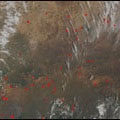 Fires (shown as red dots) smolder throughout the Sahel, March 2, 2001.