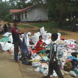 After the 2004 Southeast Asia tsunami, aid organizations provided clothing to help disaster victims like these children in Sri Lanka.