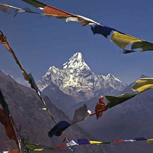 Prayer flags frame Ama Dablam Peak in the Nepalese Himalaya.