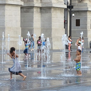 Children play in the fountains at Dilworth Park in Philadelphia.
