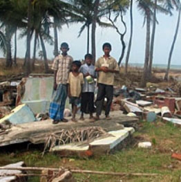 In Mankerni, Sri Lanka, four eyewitnesses to the December 26, 2004 tsunami stand on the remains of the house where they were when they first realized a tsunami was about to strike.