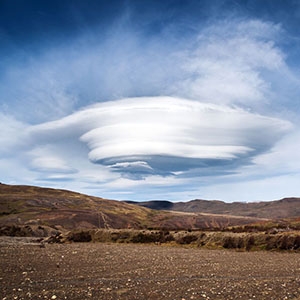 This photograph shows a large lenticular cloud hovering over part of Torres del Paine National Park, in Chile’s Patagonia region. 