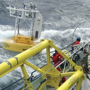 Photograph of crew members recovering a buoy that broke loose in the Gulf Stream