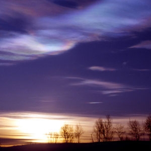 Polar stratospheric clouds form when extremely cold conditions in the high Arctic and Antarctic atmospheres cause nitric acid and water to freeze into tiny crystals. 