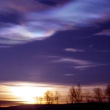 Polar stratospheric clouds form when extremely cold conditions in the high Arctic and Antarctic atmospheres cause nitric acid and water to freeze into tiny crystals. 