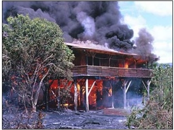 In 1990, slow-moving pahoehoe lava from Kilauea Volcano gradually spread through the community of Kalapana, burning homes and covering parks, roads, and gardens. (Image courtesy of USGS)