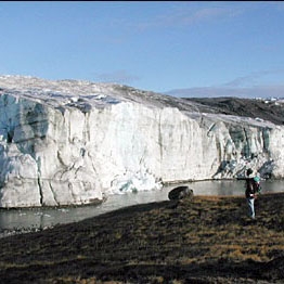 A researcher observes the edge of the Greenland Ice Sheet in 2001. (Image courtesy of Ted Scambos, National Snow and Ice Data Center, University of Colorado at Boulder).