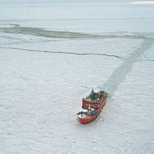 The icebreaker Aurora Australis churns through pack ice surrounding East Antarctica