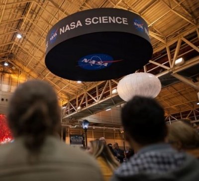 Photo of people approaching the NASA booth at AGU