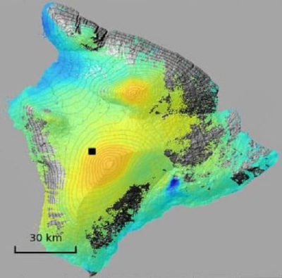 This SAR displacement image shows the degree of land subsidence following an earthquake. There is a color spectrum ranging from blue to green to yellow to orange to red, with red indicating the most subsidence (measured in centimeters) and blue indicating the least. The largest area of color on this island is in the yellow to green range.