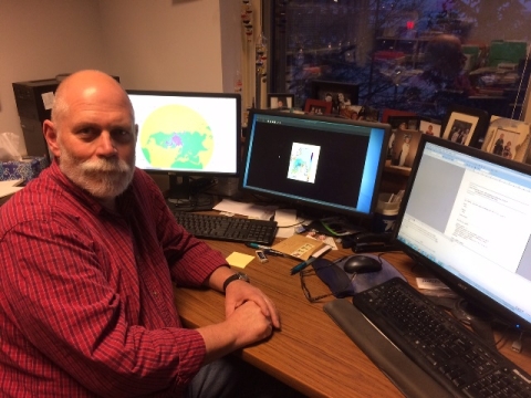 Photograph of Dr. Mark Anderson sitting at a desk