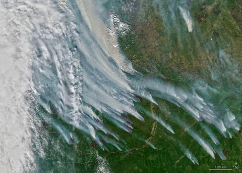 The Moderate Resolution Imaging Spectroradiometer (MODIS) on NASA’s Aqua satellite acquired this natural-color image of large clouds of smoke spreading over Sakha on August 8, 2021. Plumes of this size and opacity have been common for weeks, leading to poor air quality for many of the 280,000 people who live in the nearby city of Yakutsk. Credit: NASA Earth Observatory.