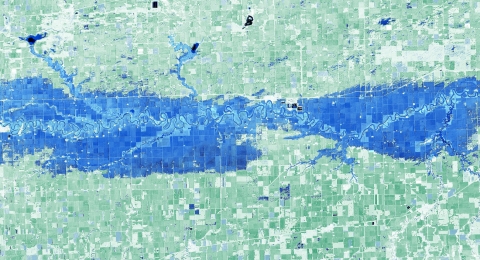 A view of the Red River Valley in Minnesota and North Dakota shows land colored in green and flooded areas in blue.