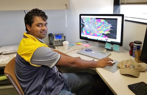 Dr. Piyush Agram in his JPL office.