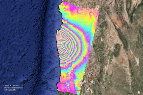 Example of an interferogram created from SAR imagery. This example shows ground displacement caused by an earthquake in Chile in 2015. Displacement is indicated by multi-colored fringes, with the distance between fringes of the same color indicating 8.5 cm of displacement.