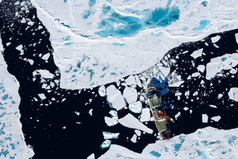 Aerial photograph showing a research icebreaker in the Arctic Ocean