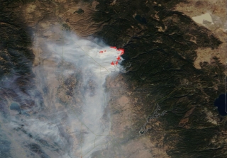 Satellite image of smoke with red dots indicating hotspots