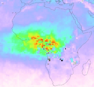 Map of Africa with green area across center of continent; red/yellow/orange spots are within the green area indicating higher CO concentrations.